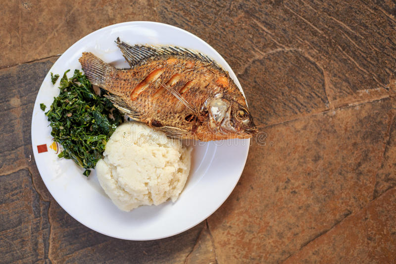 traditional-african-food-ugali-fish-greens-east-kenya-83545726